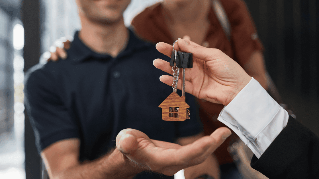 man getting keys for new home in greater edmonton