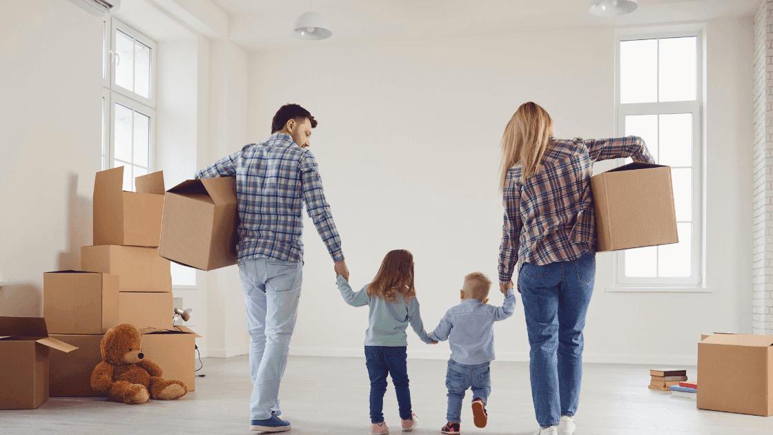 couple and their children moving into a new home in Leduc AB