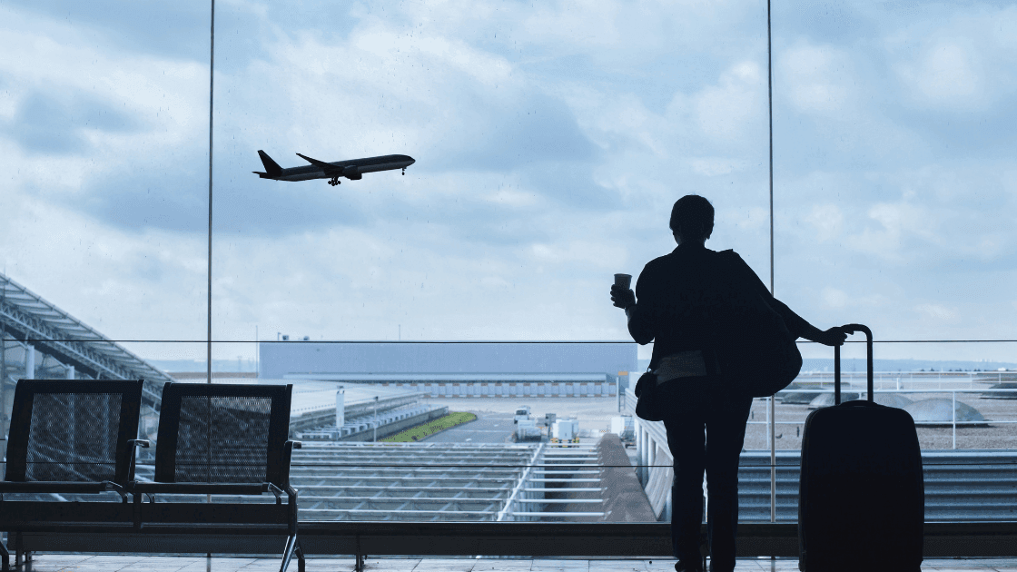 Woman waiting for flight at Edmonton International Airport in Leduc